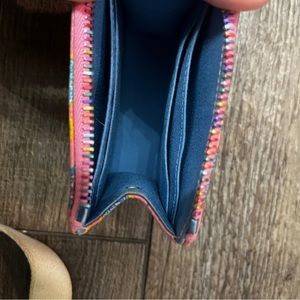 Dooney and bourke rainbow hearts card wallet.